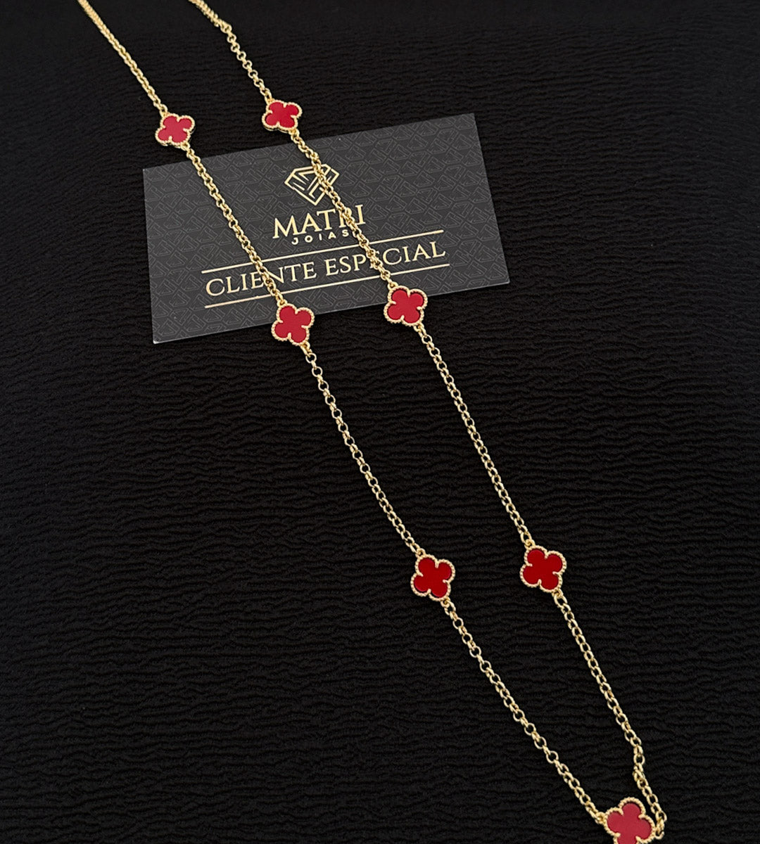 Corrente 7 Trevos Vermelho 70cm Banhada a Ouro 18k